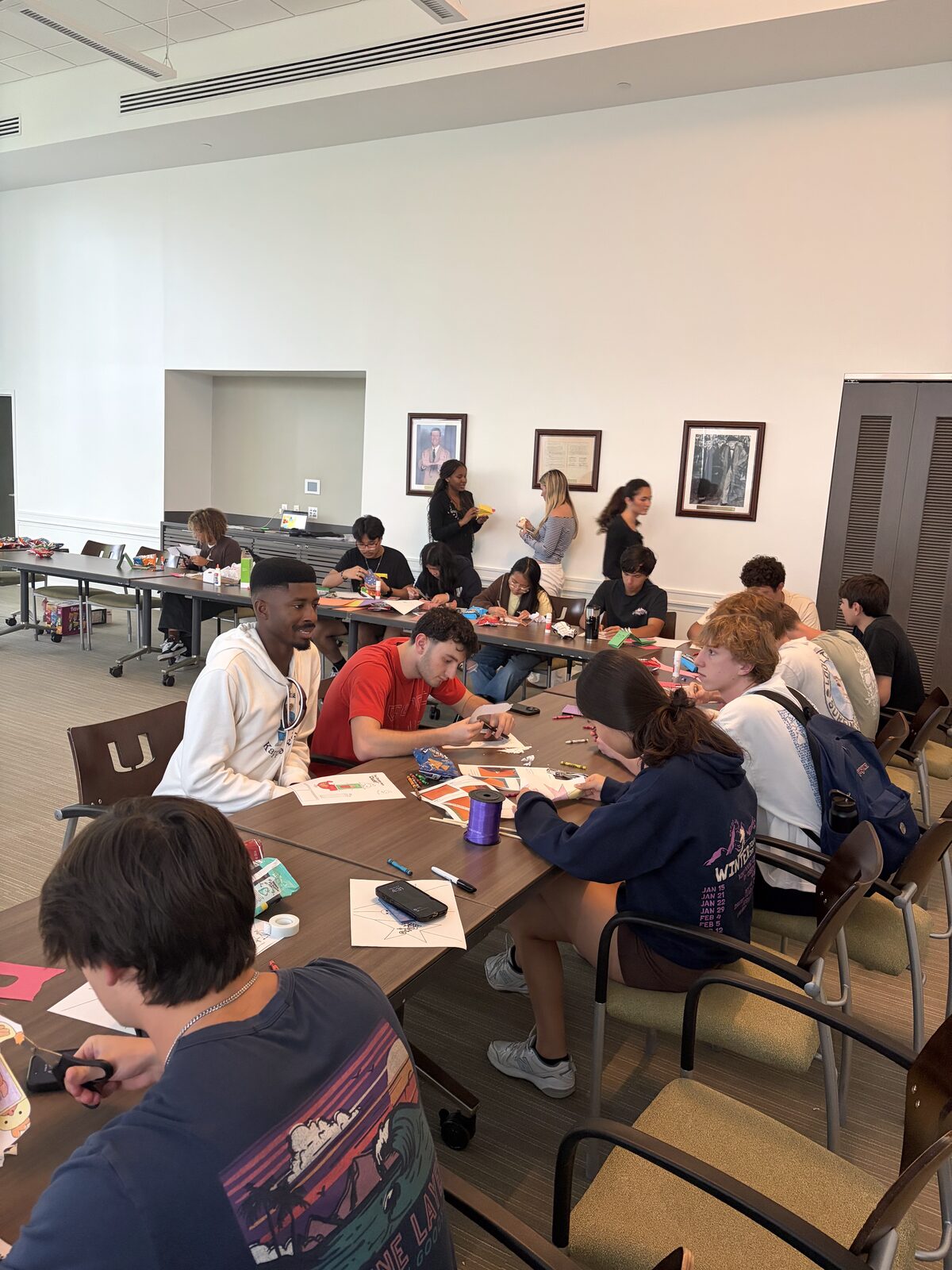 Brothers working on cards at a service event
